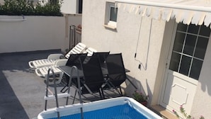 A rectangular swimming pool with a blue interior and a white exterior. - Apartment Glavica- Two Bedroom Apartment with Terrace (Supetar)