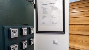 A hotel room with a door featuring a keycard entry system and a framed 'HOST RECOMMENDATIONS' sign listing local attractions and amenities. - Guest House Lumin - Deluxe Single Room with City View (Fourth Floor) (BR5) (Dubrovnik)
