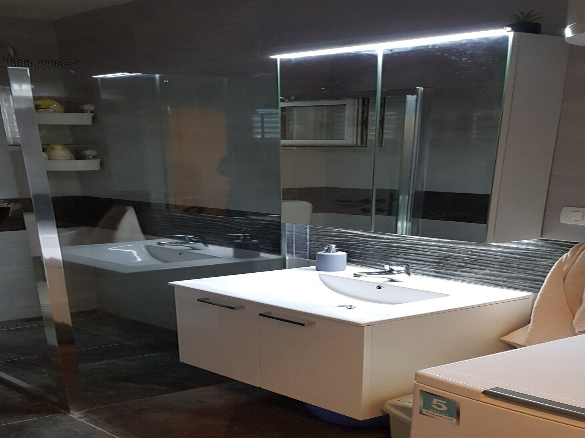 Bathtub, hair dryer, towels