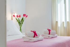 Relax in comfort with a neatly made bed, fresh towels, and a touch of elegance.