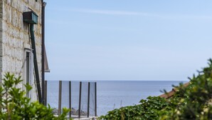 A coastal building with a view of the sea.