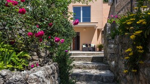 A stone staircase leading to a building with a window and a door. - Studio Maro - Studio Apartment with Terrace (Dubrovnik)