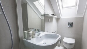 A modern bathroom with a large sink, a toilet, and a shower. - Apartments & Rooms Lejletul- Deluxe Studio Apartment (A2) (Dubrovnik)