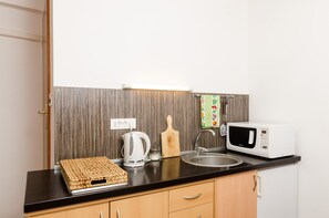 Fridge, microwave, stovetop, cookware/dishes/utensils