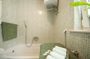 Bathtub, hair dryer, towels