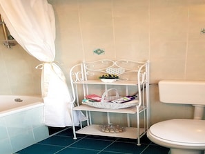 Bathtub, hair dryer, towels