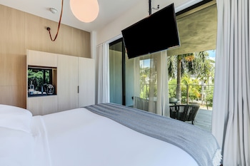 Minibar, in-room safe, desk, laptop workspace at The March Hotel