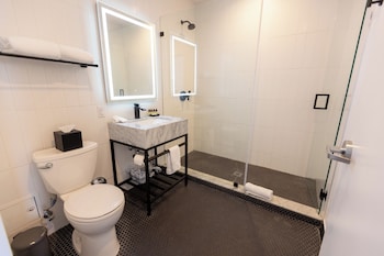 Shower, hair dryer, towels, soap at Urbanica The Euclid