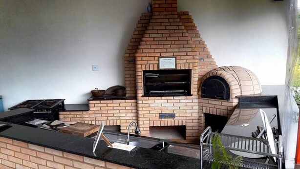 An outdoor kitchen with a brick oven, a grill, and a sink. - OUR PARADISE available Christmas New Year <br>End of March holiday promotion 981113133 (Arujá)