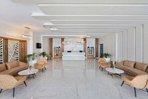 A spacious lobby with a reception desk, plush seating, and a modern design. - Pickalbatros White Beach Taghazout - Adults Friendly 16 Years Plus - Ultra All Inclusive (Taghazout)