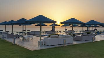 On the beach, sun loungers, beach umbrellas, beach towels
