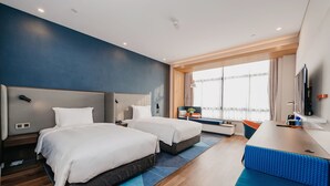A modern hotel room with two beds, a desk, a TV, and a large window with curtains. - Holiday Inn Express Taizhou CMC by IHG (Taizhou)