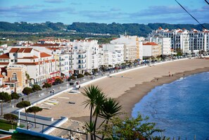 On the beach, sun-loungers
