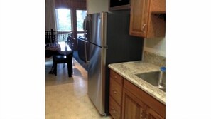 Royal Cottage | Private kitchen | Full-size fridge, microwave, oven, stovetop