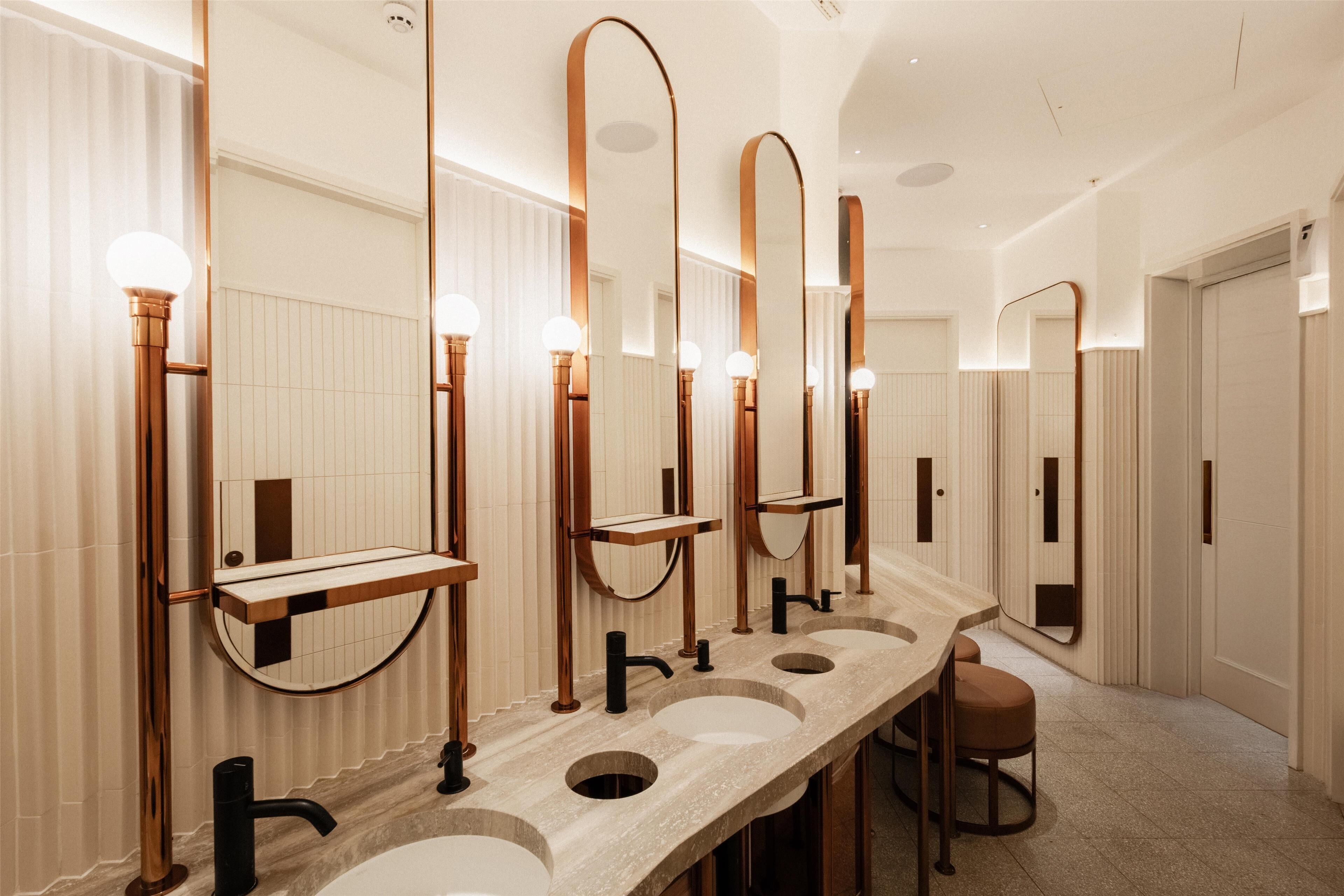 designer toiletries, hair dryer, slippers, towels