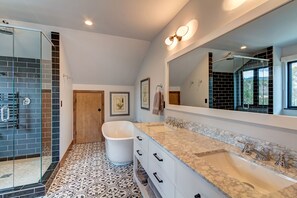 Combined shower/bathtub, hair dryer, towels, soap