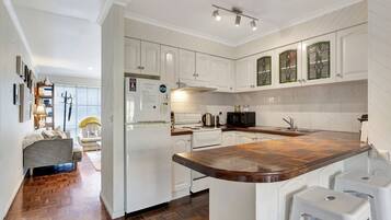 Fridge, dishwasher, toaster, cookware/dishes/utensils