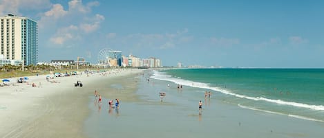 On the beach, sun loungers, beach towels