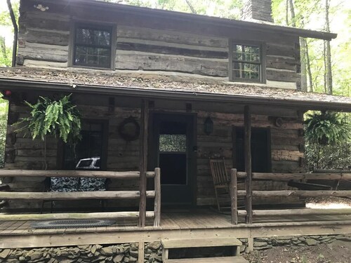 Come to the mountains to a rustic cabin by a creek.