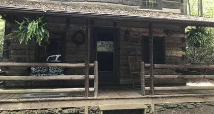 Come to the mountains to a rustic cabin by a creek.