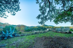 Surrounded by lush vegetation and rolling hills, this serene landscape offers a peaceful escape.