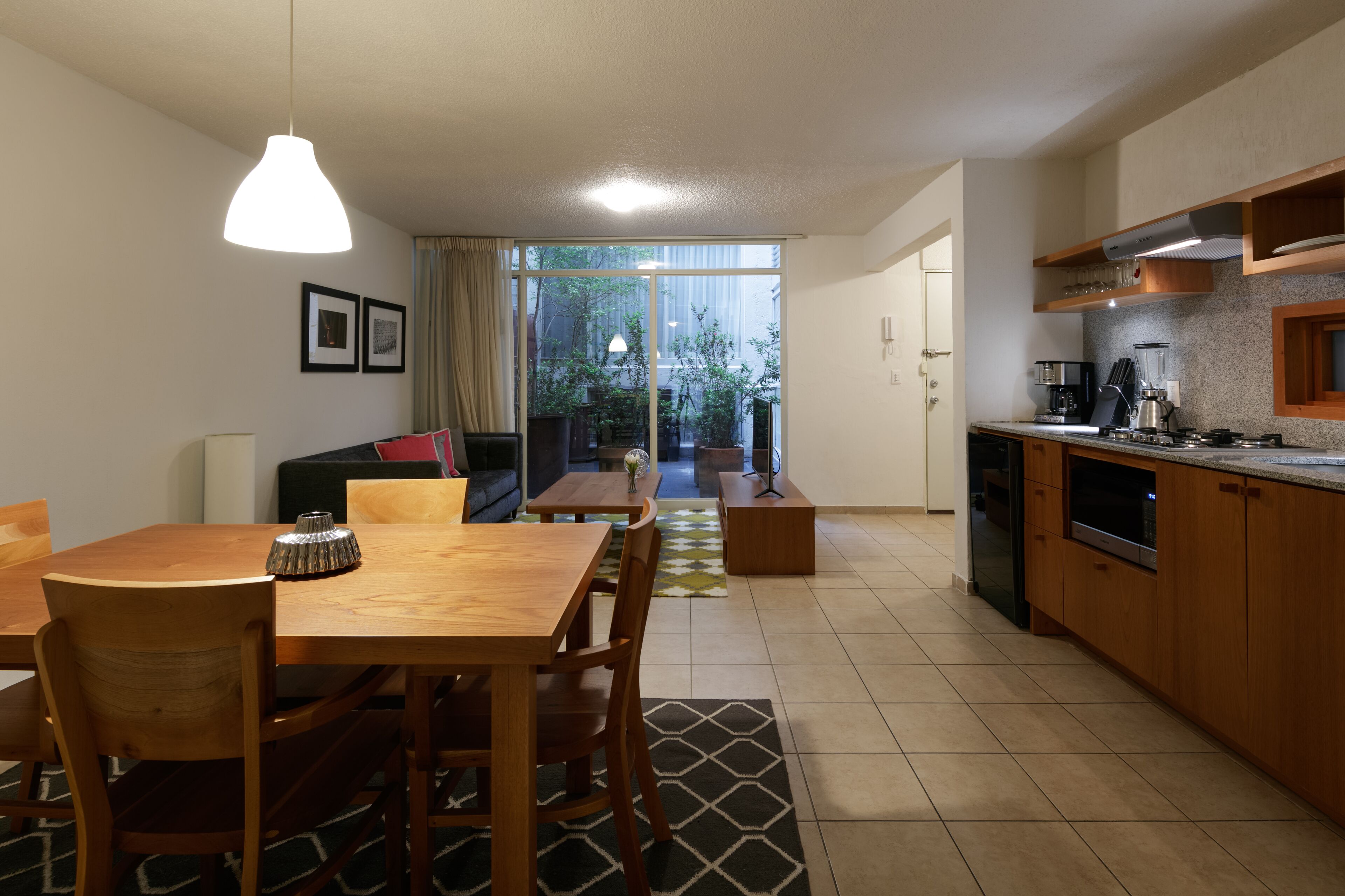 Fridge, microwave, coffee/tea maker, cookware/dishes/utensils