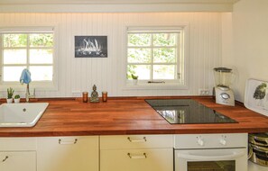 Fridge, stovetop, dishwasher, coffee/tea maker