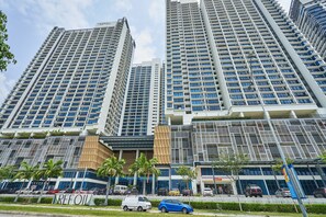 A high-rise building with multiple floors, large windows, and a modern architectural design.