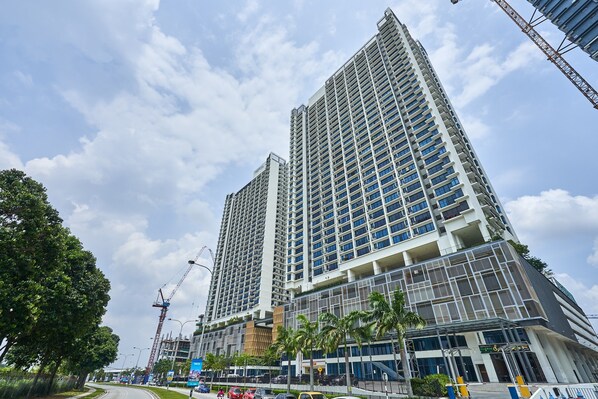 A high-rise building with multiple floors, large windows, and a modern architectural design.