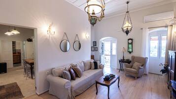 Traditional Quadruple Room, 2 Bedrooms | Living area | 43-inch flat-screen TV with satellite channels, TV, fireplace