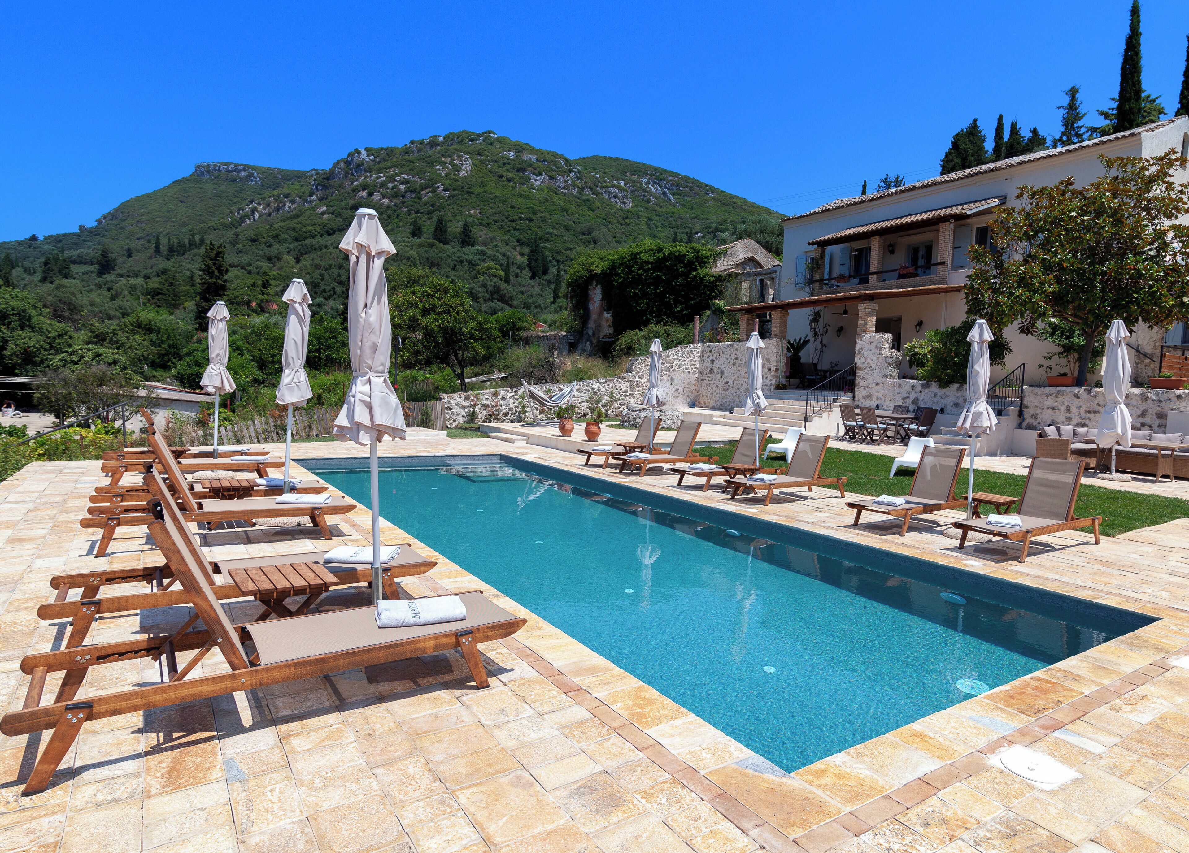 Seasonal outdoor pool, pool umbrellas, pool loungers