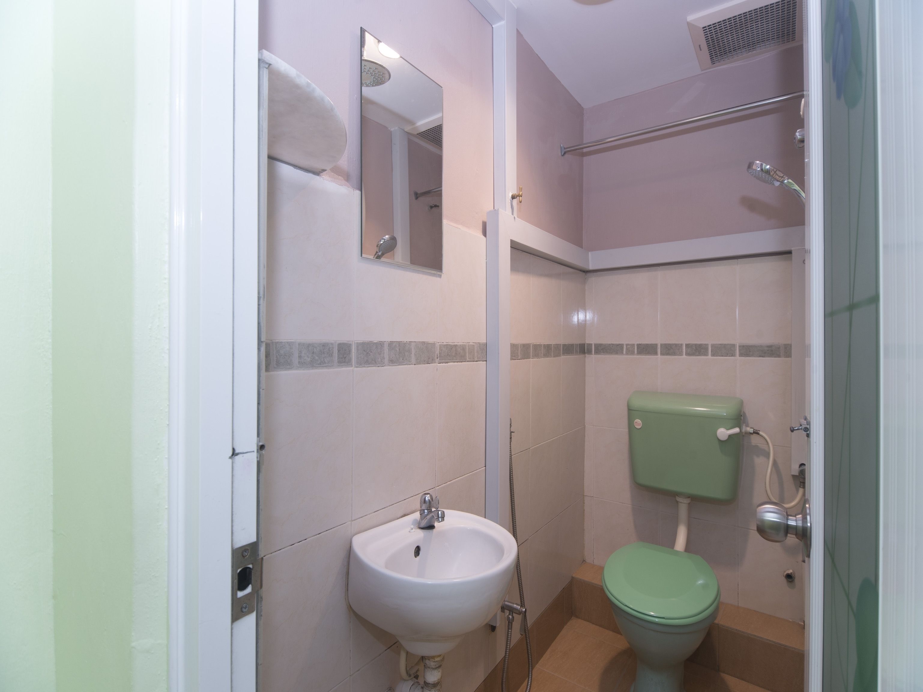 A bathroom with a sink, toilet, and shower.
