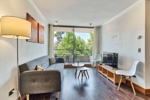 Apartamento | Área de estar | TV de tela plana 60 polegadas com canais a cabo, TV