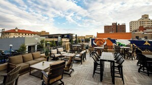 An outdoor patio area with various seating options including sofas, chairs, and tables. - The Barfield, Autograph Collection (Amarillo)