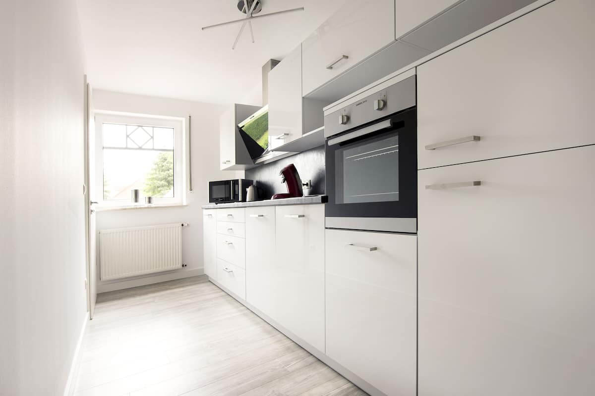 Deluxe Apartment, Balcony | Private kitchen | Full-size fridge, microwave, oven, stovetop