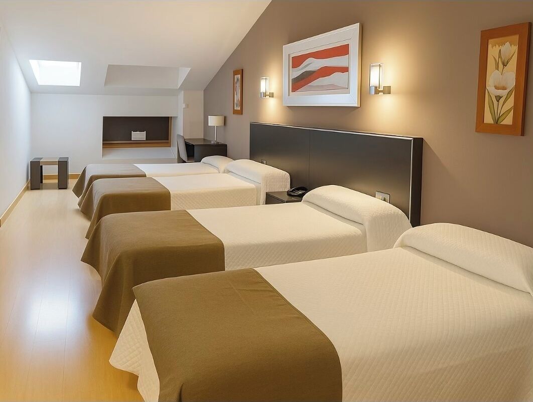 Quadruple Room | Minibar, in-room safe, desk