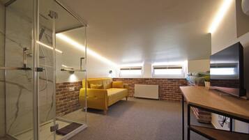 Deluxe Room, Non Smoking, Courtyard View | Living area | TV