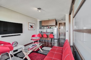 Apartment | Living area | 30-inch flat-screen TV with cable channels, TV