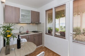 Fridge, stovetop, coffee/tea maker, cookware/dishes/utensils