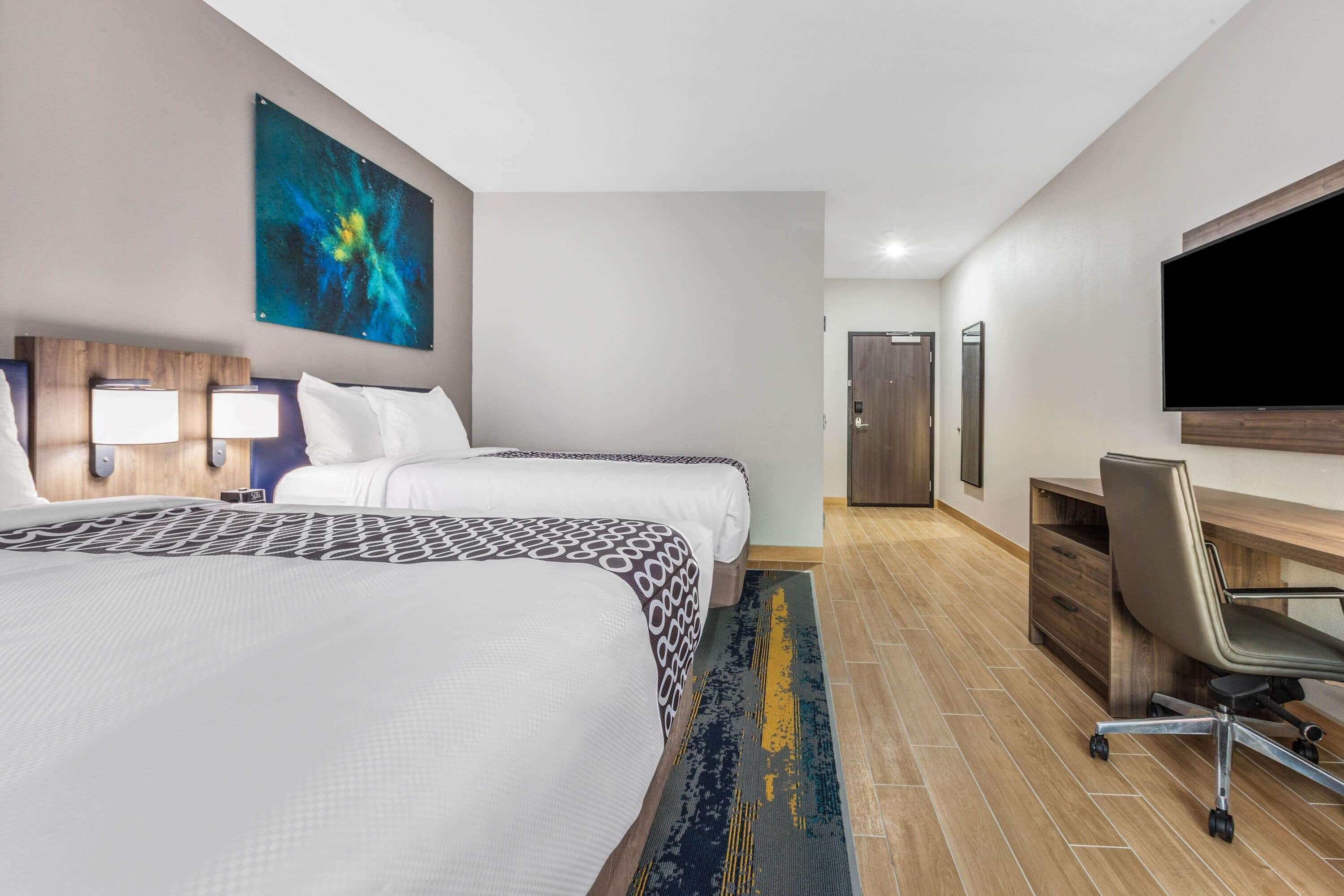 pillow-top beds, desk, laptop workspace, blackout curtains