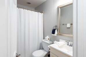 Bathtub, hair dryer, towels