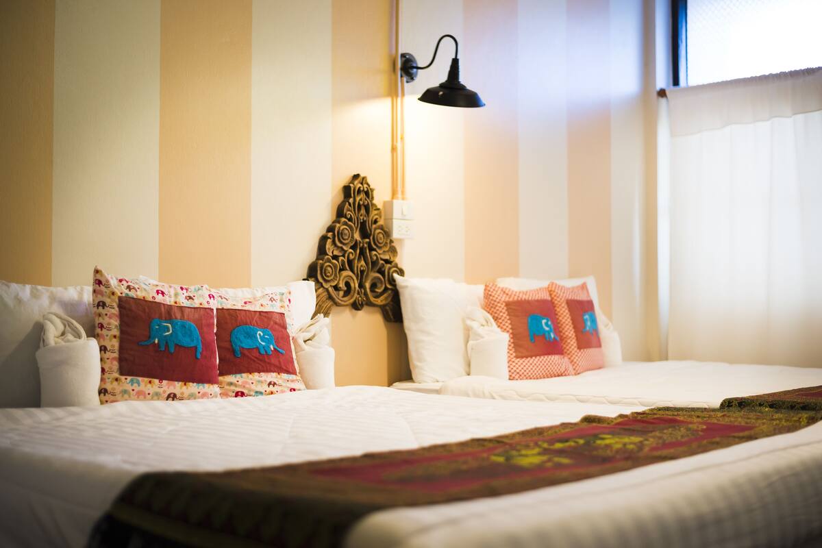 Family Quadruple Room | Living area | Flat-screen TV