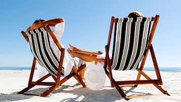 On the beach, sun-loungers