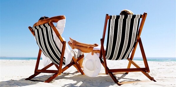 On the beach, sun-loungers