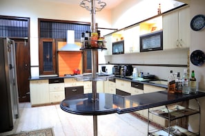 Fridge, microwave, stovetop, cookware/dishes/utensils