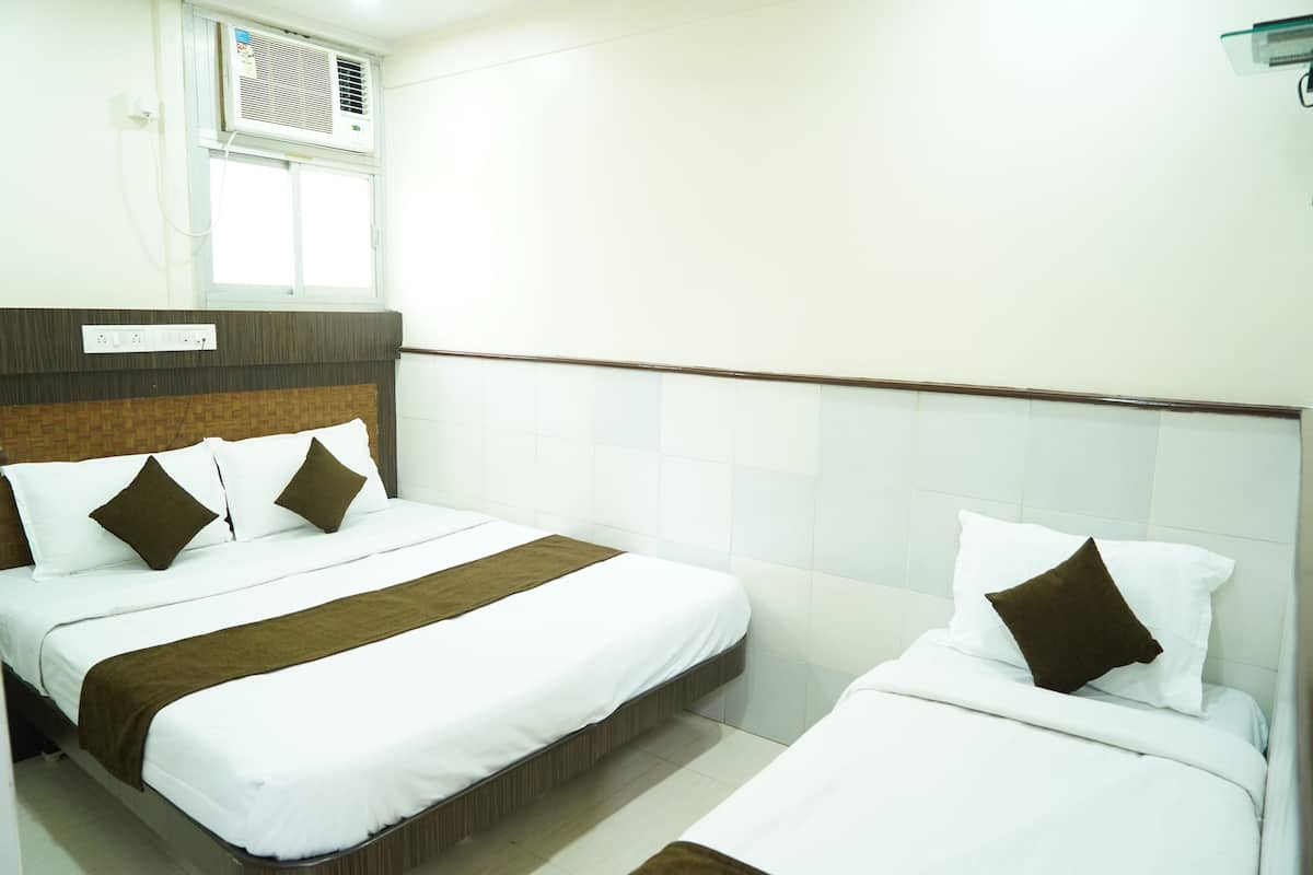 Triple Room (AC) | Desk, blackout drapes, WiFi (free), bed sheets