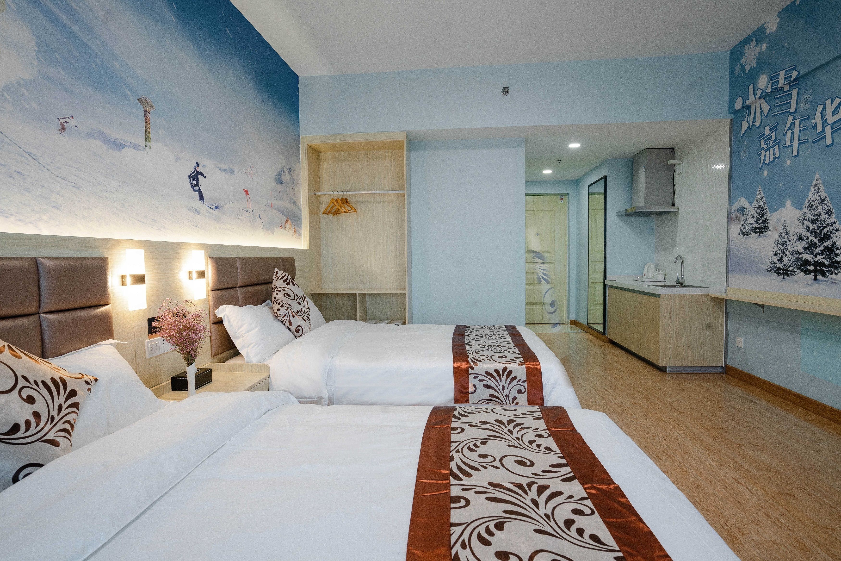 A hotel room with two beds, a nightstand with a lamp, a wall-mounted TV, and a large window.