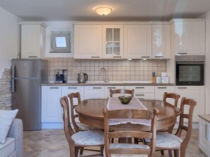 Fridge, oven, cookware/dishes/utensils