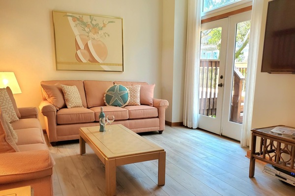 New Sunbrella Living Room Furniture and
Hardwood Plank Flooring throughout