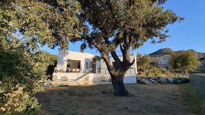 A modern building with a balcony and outdoor seating area. - Villa Rossa, Contemporary Heated pool  (PALASCA)